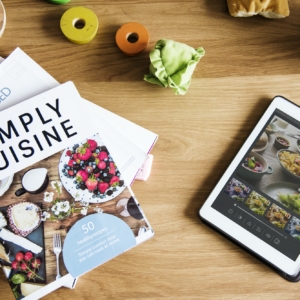 Tablet and magazines on table
