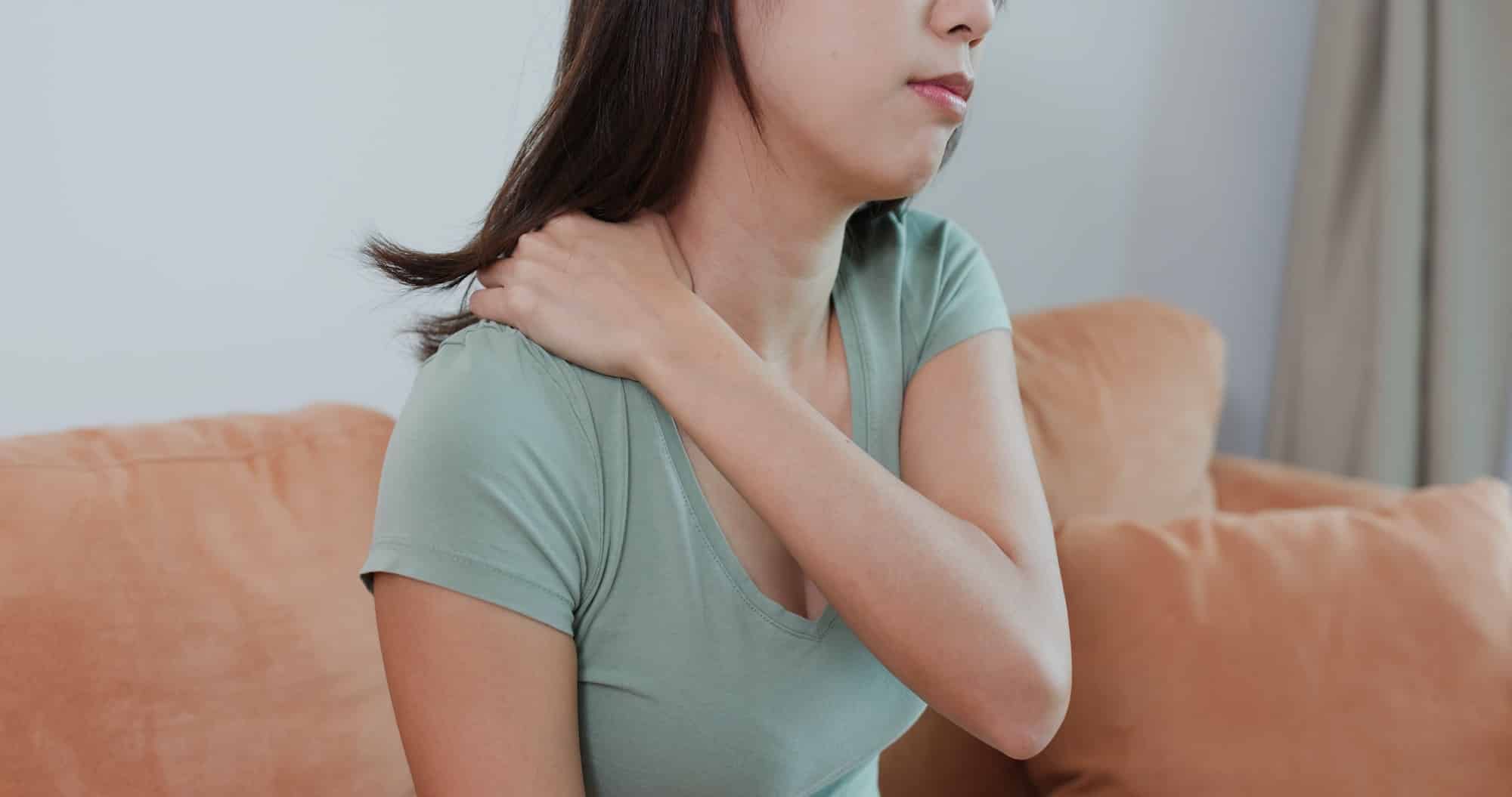 Woman tired with shoulder pain