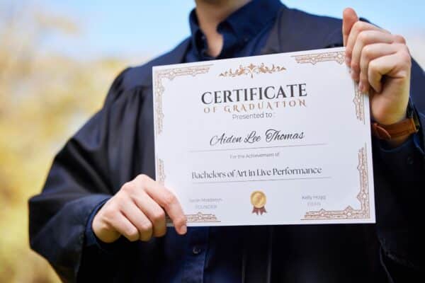 University, hands and closeup of a graduation certificate for success, achievement or goal. Scholar